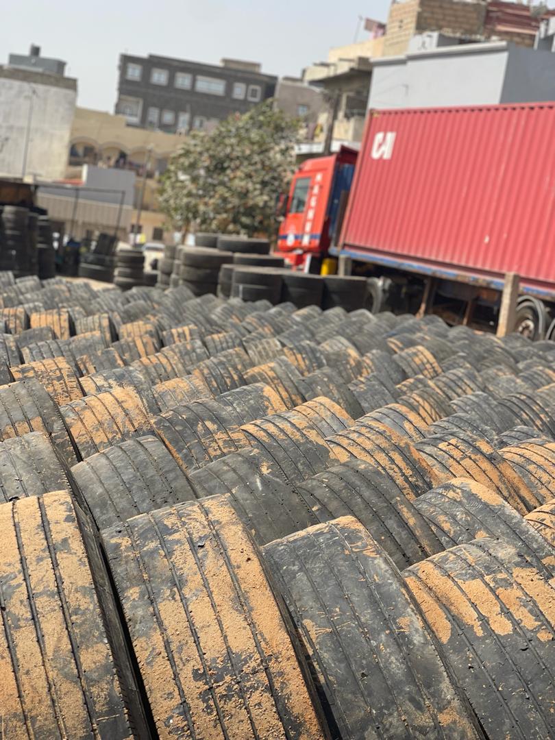 Truck tyres and a container at our Dakar yard
